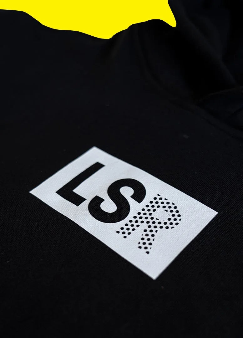 Close-up of the LSR box logo print on the black staple hoodie